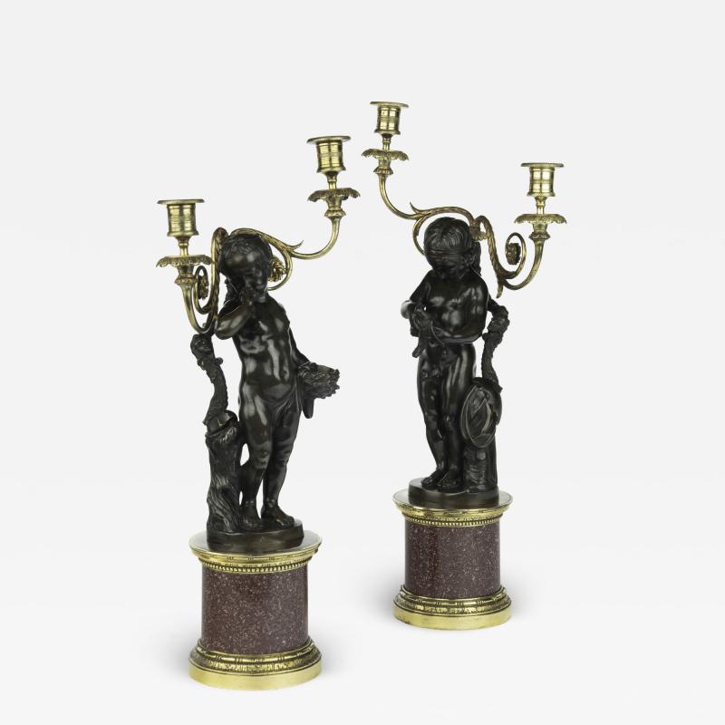 A pair of Egyptian porphyry and bronze candelabra after Charles Antoine Bridan