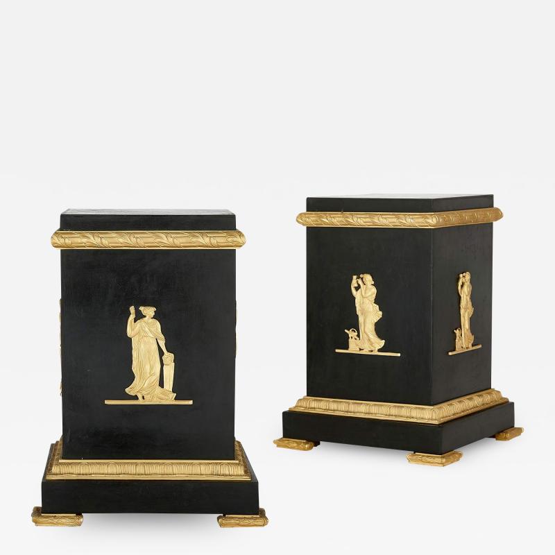 A pair of Empire style Neoclassical gilt and patinated bronze stands