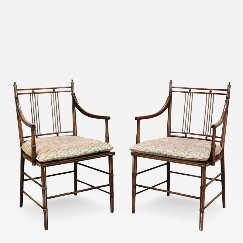 A pair of English Regency style faux bamboo armchairs with cane seats 19th C 