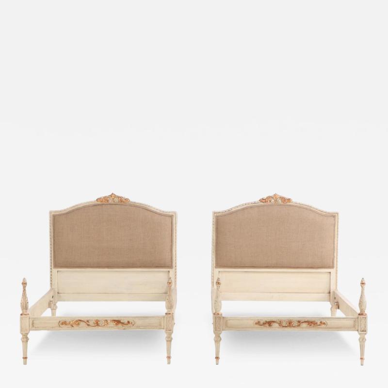 A pair of French Louis XVI style painted twin beds C 1940 