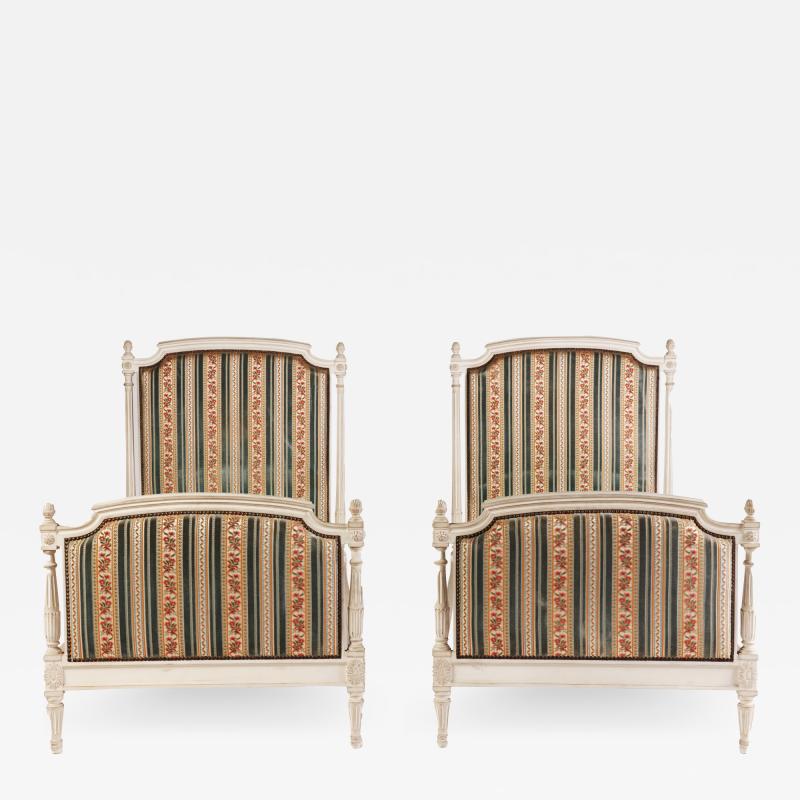 A pair of French Louis XVI style painted twin beds Circa 1950 