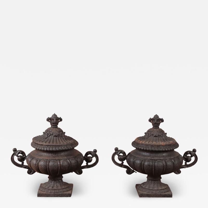 A pair of French cast iron garden urns with removable winter covers 19th C 