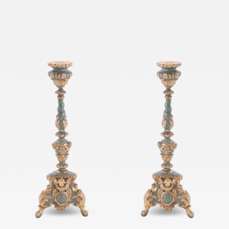 A pair of French painted and giltwood altar candlesticks C 1820 