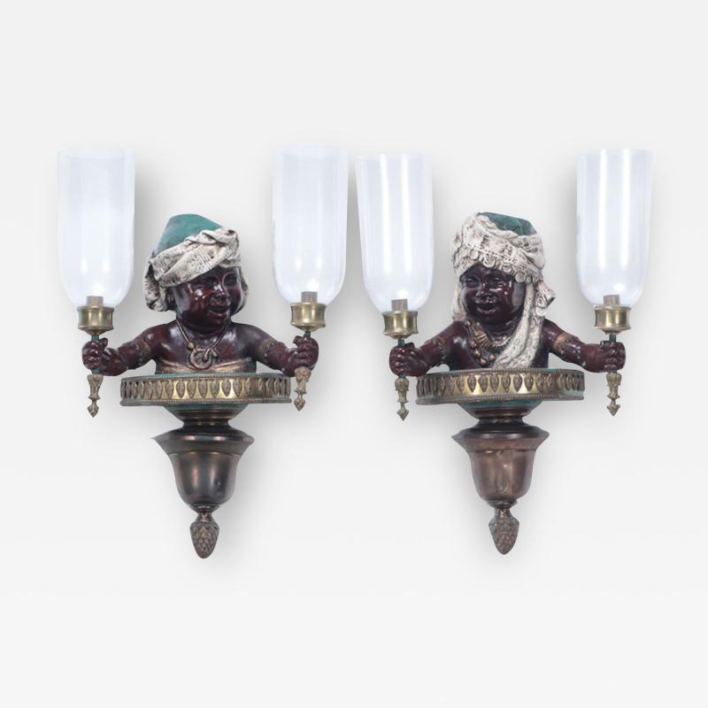 A pair of French vintage patinated brass figural wall sconces 19th C