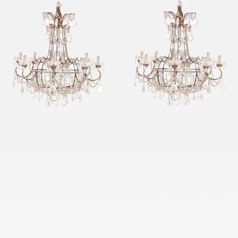 A pair of Italian iron and crystal eight arm chandeliers C 1950 