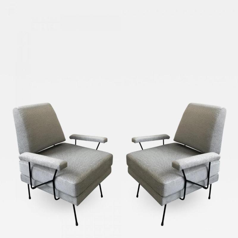 A pair of Mid Century Modern iron armchairs newly upholstered 