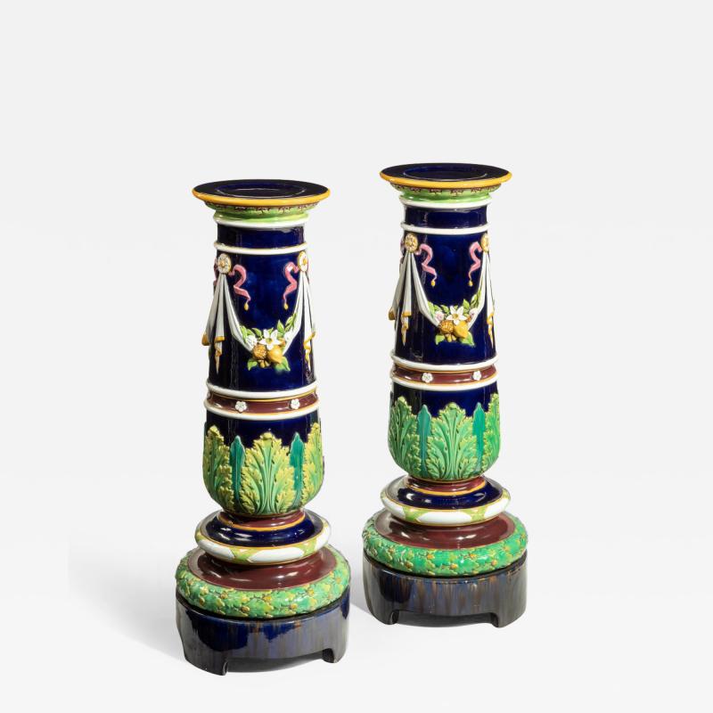 A pair of Victorian majolica jardini re stands by Minton