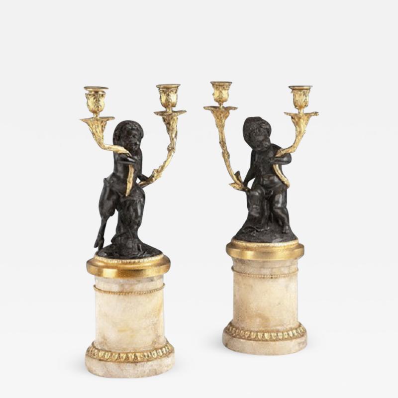 A pair of antique French bronze and gilt Candelabra