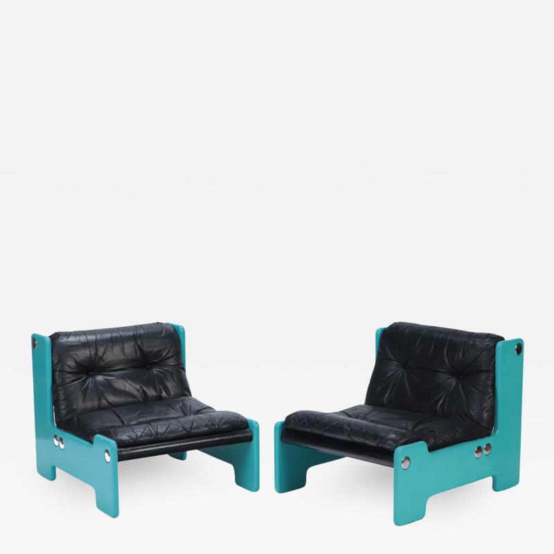 A pair of blue framed lounge chairs with black leather seats C 1970 