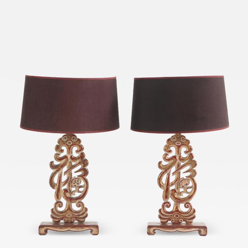 A pair of carved table lamps in the manner of James Mont C 1950 