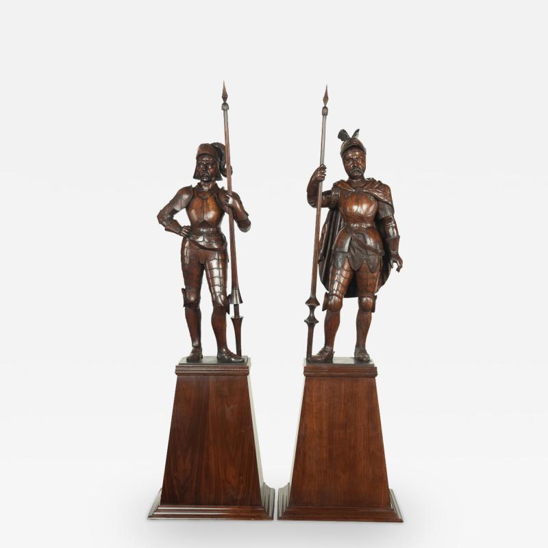 A pair of carved walnut mediaeval knights