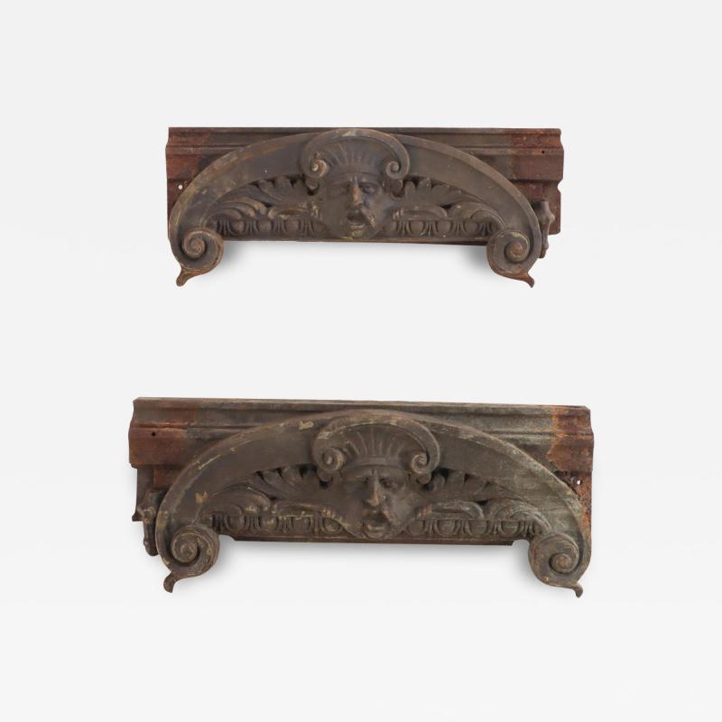 A pair of cast iron capitals with faces C 1890 