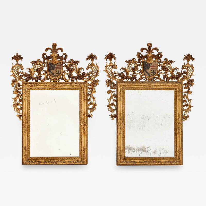 A pair of giltwood and polychrome decorated antique Italian mirrors