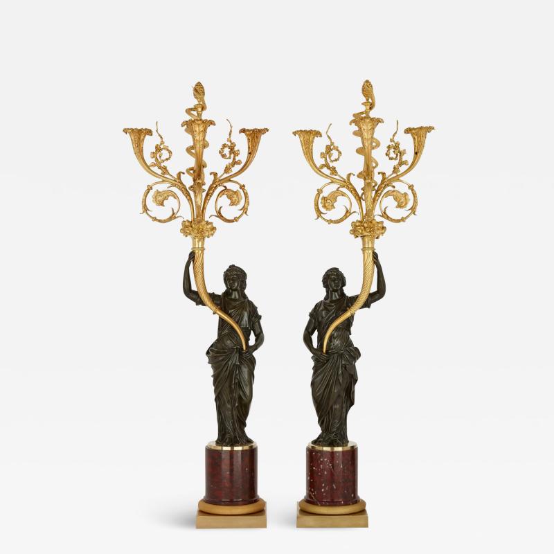 A pair of large French ormolu and patinated bronze candelabra