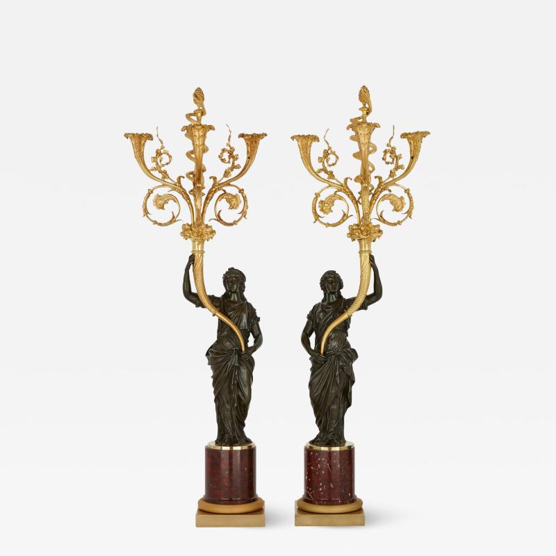 A pair of large French ormolu and patinated bronze candelabra