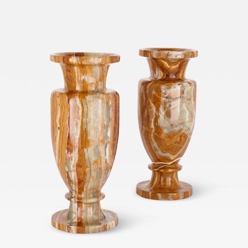 A pair of large decorative vases in red and green onyx