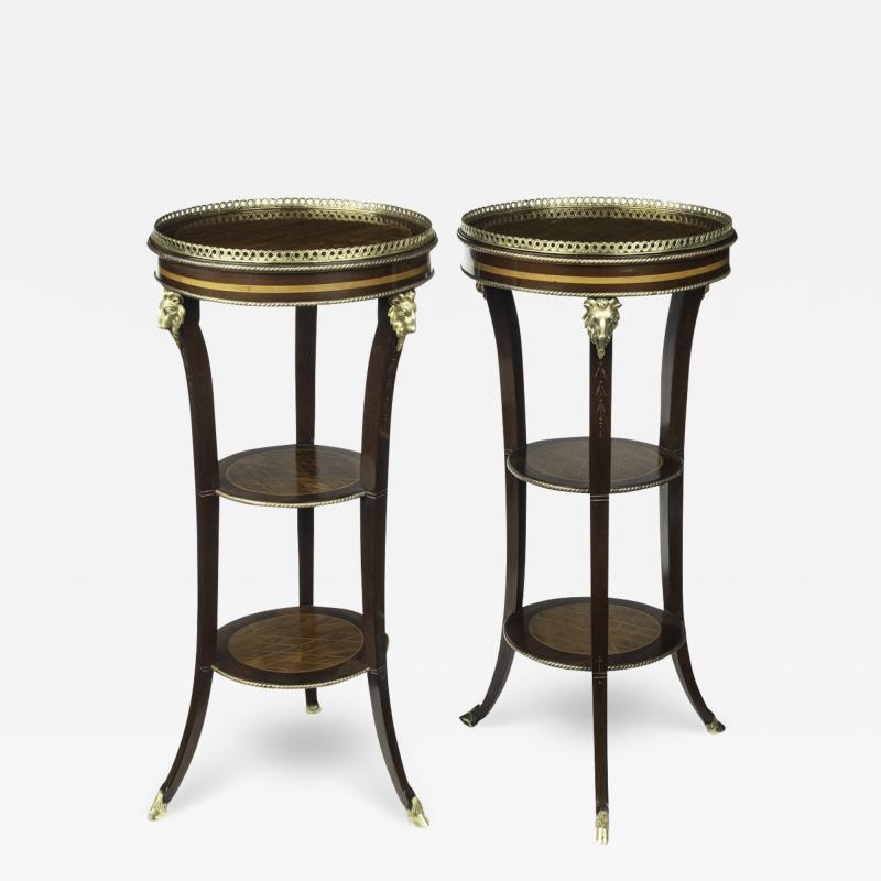 A pair of late 19th century French 3 tier satinwood side tables