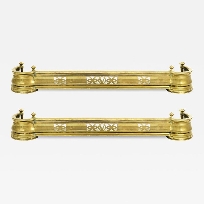 A pair of late Victorian brass kerb fenders