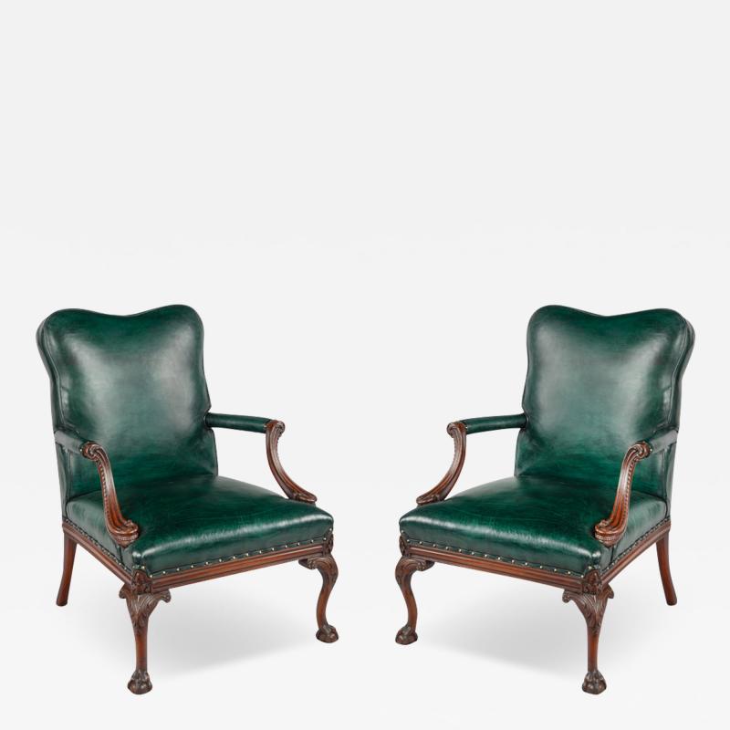 A pair of mahogany open armchairs in the style of Chippendale 