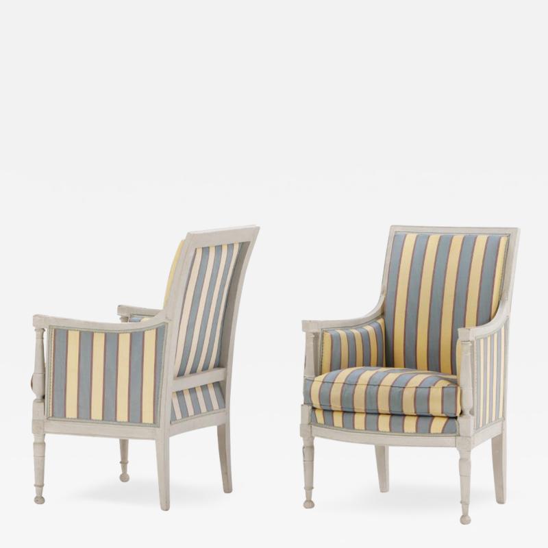 A pair of painted French Directoire style bergere chairs C 1900 