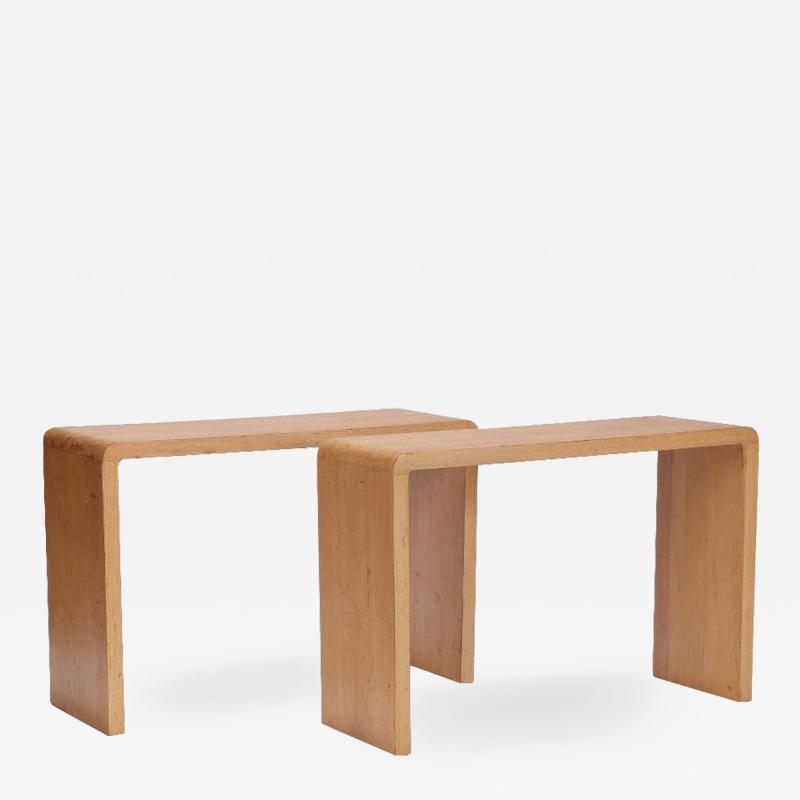 A pair of rounded cerused oak console tables Contemporary
