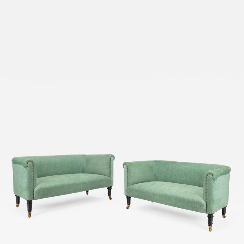 A pair of small Victorian window sofas