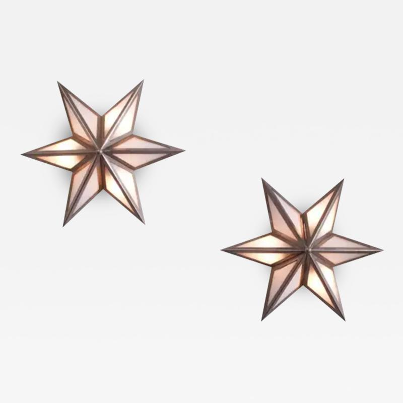 A pair of star shaped wall sconces made of steel and glass Italy 1960s