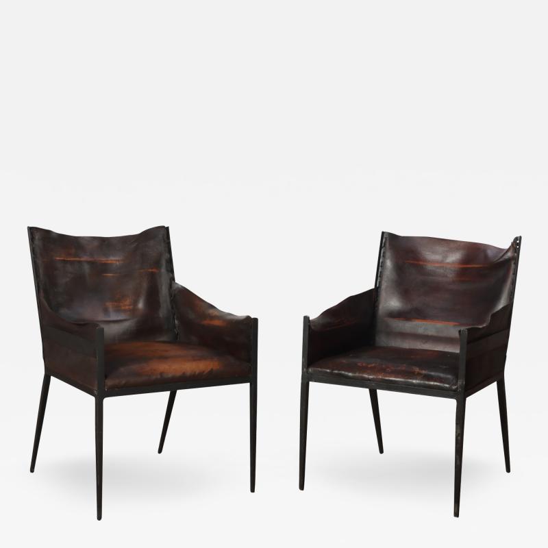 A pair of vintage iron and leather armchair Contemporary