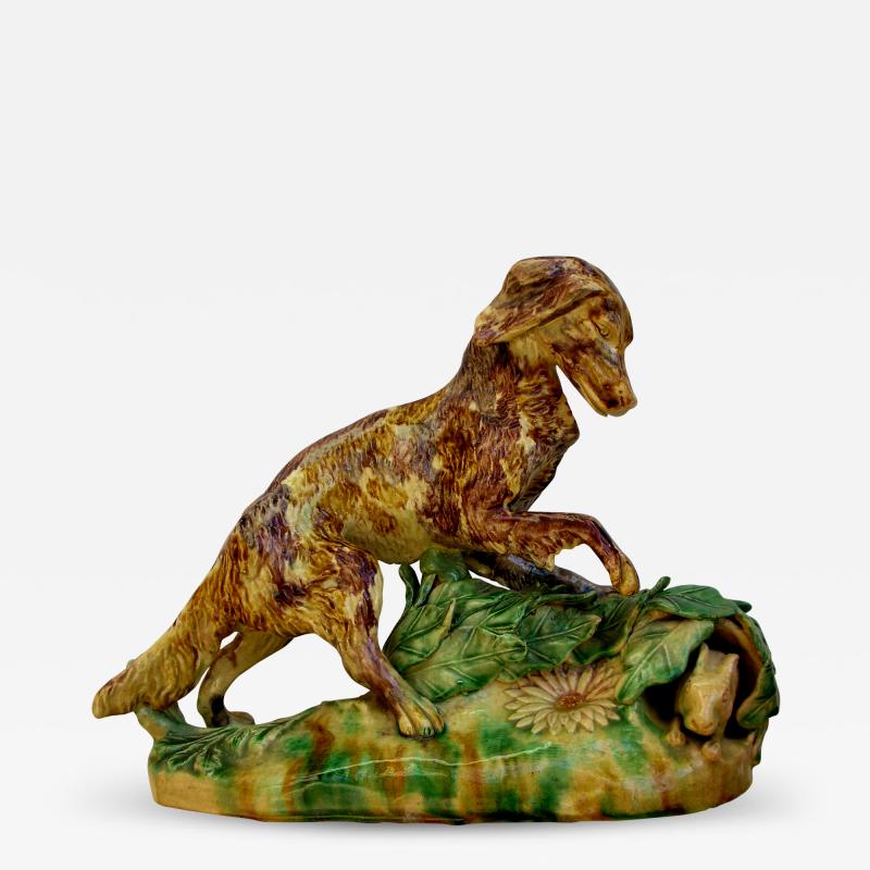 A rare English Yellow Ware figure of a hunting dog and hare