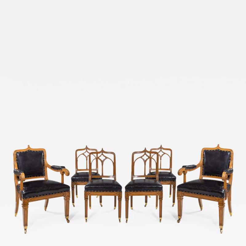 A set of six Gothic oak dining chairs