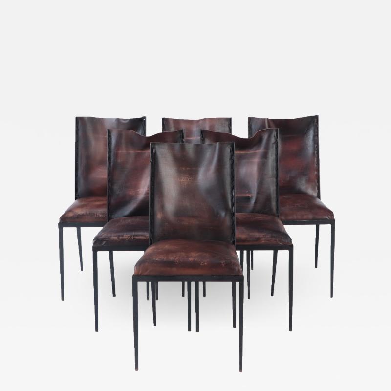 A set of six iron and leather dining chairs Contemporary 