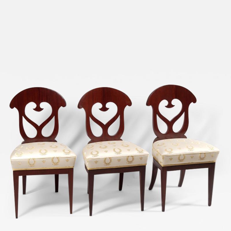 A set of three Biedermeier side chairs