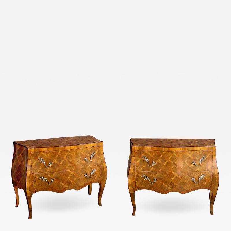 A shapely pair of Italian rococo style olive wood chests with parquetry inlay