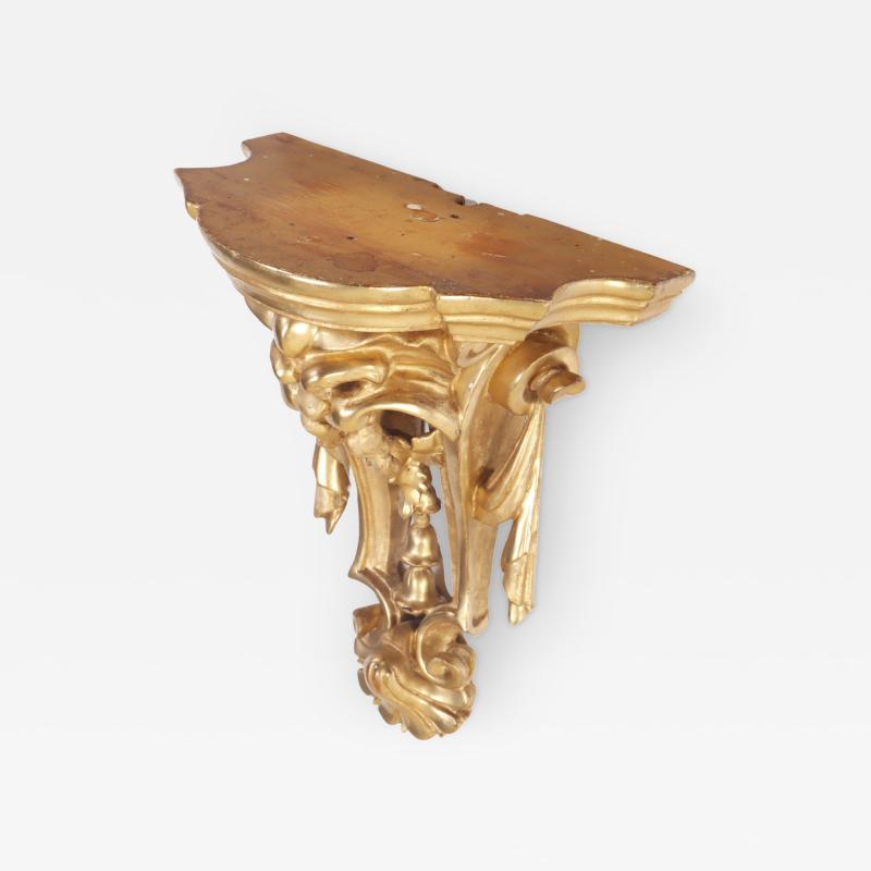 A small French gilt and carved wood wall mounted shelf circa 1880 