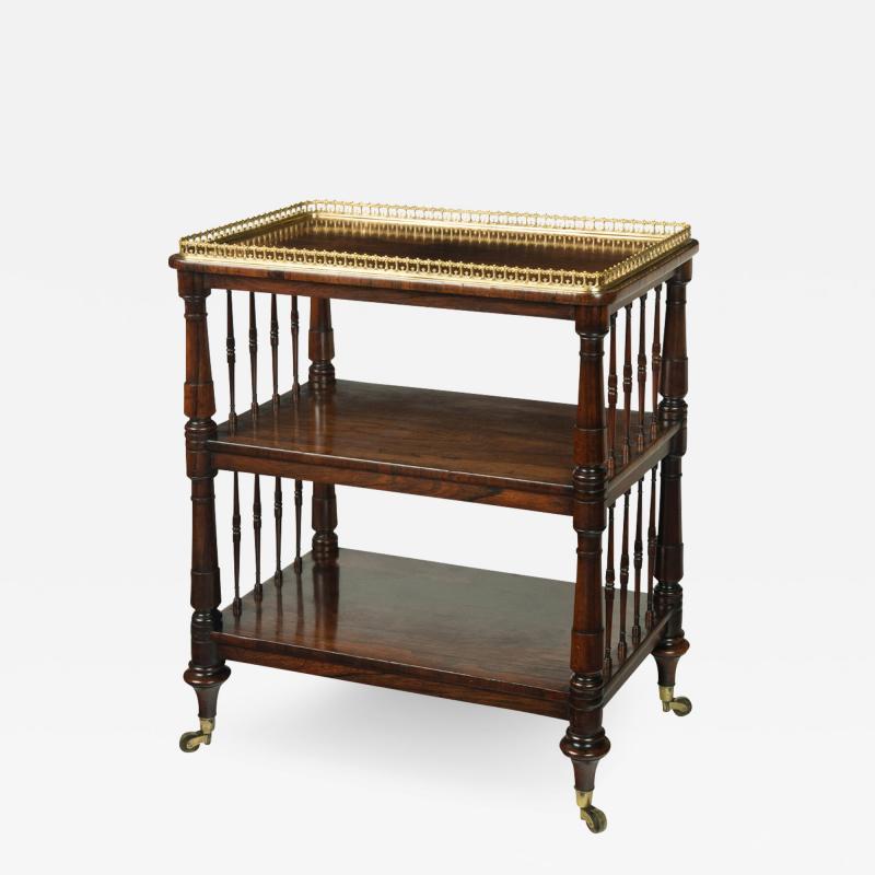 A small late Regency free standing rosewood open bookcase attributed to Gillows