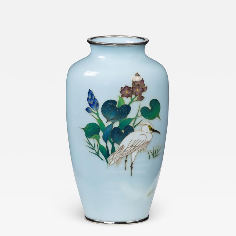 A small light blue cloisonne enamel vase with an egret