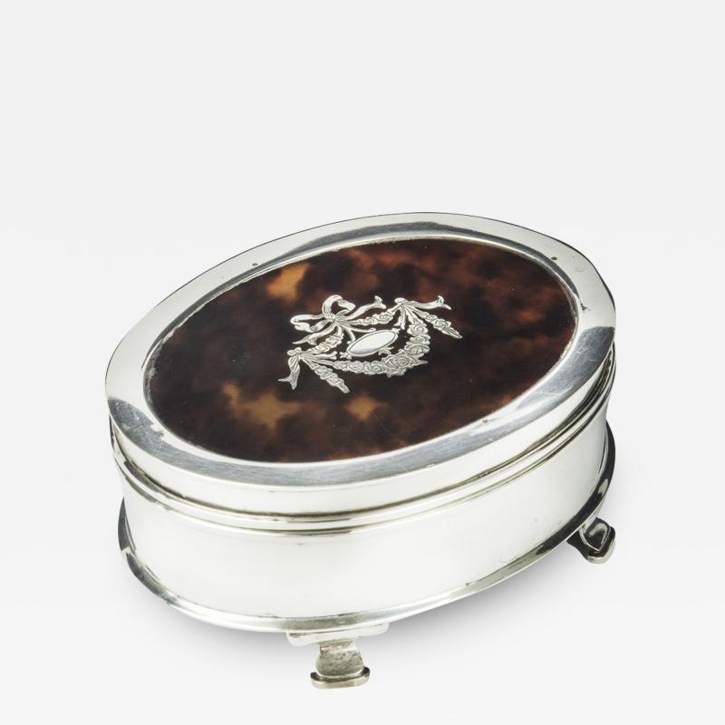 A small oval tortoiseshell piqu patch pot