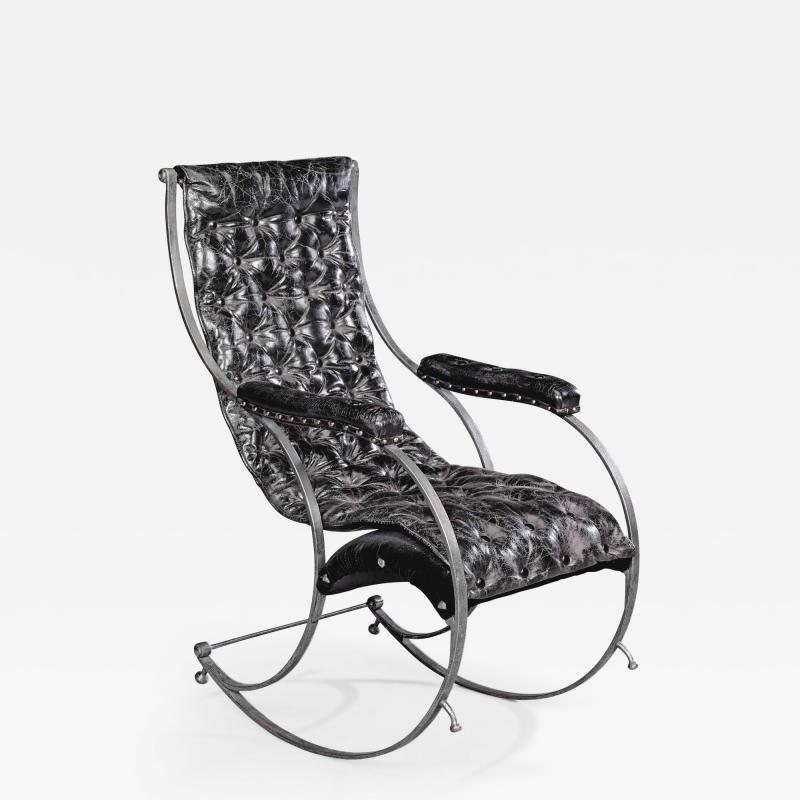 A steel and leather rocking chair in the manner of R W Winfield