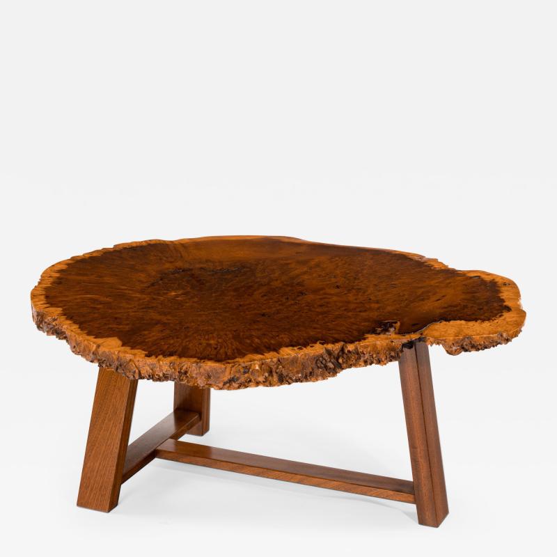 A stylish polished Amboyna Coffee Table