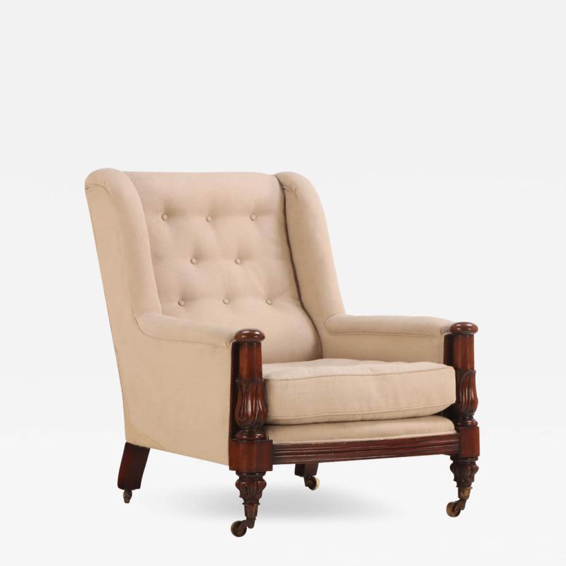A substantial English Regency carved mahogany library chair C 1830 
