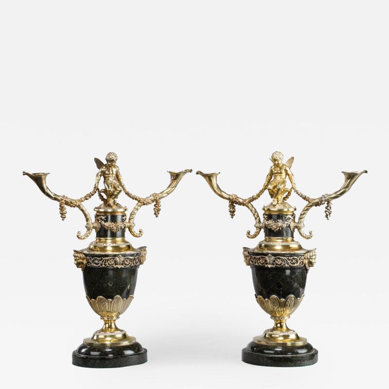 A superb pair of Victorian silver gilt candelabra