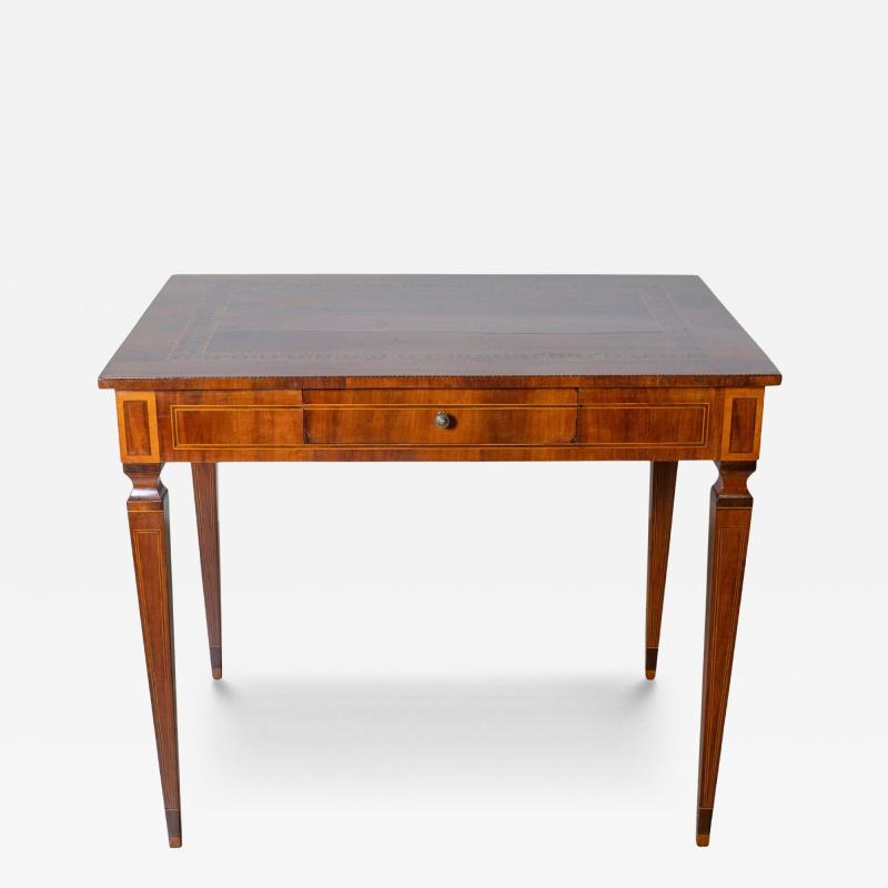 A very elegant walnut table desk with a central drawer