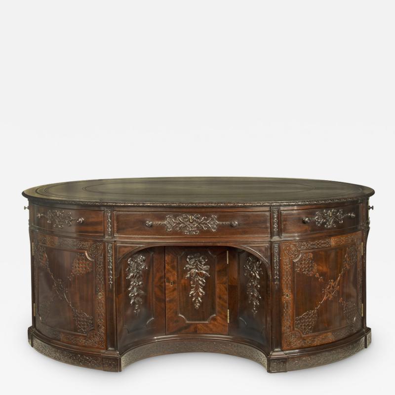 A very large mahogany centrepiece partners desk in the Chippendale style