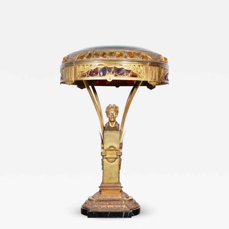 AN AUSTRIAN ART NOUVEAU GILT BRONZE AND GLASS FIGURAL TABLE LAMP CIRCA 1900