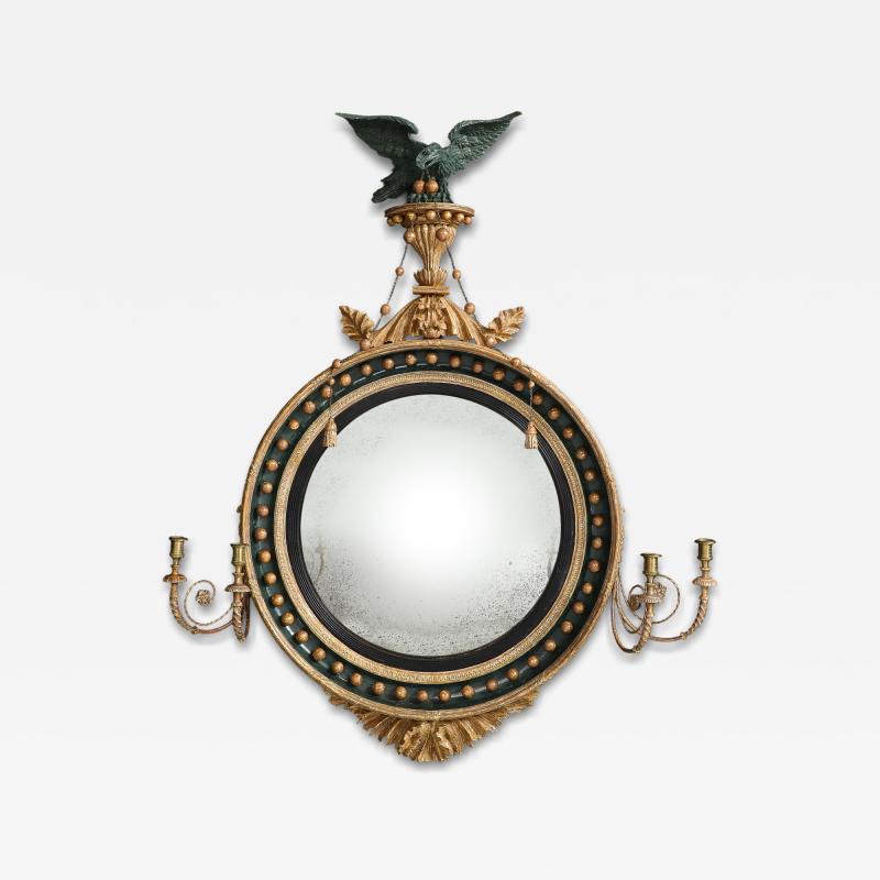 AN ENGLISH REGENCY GILTWOOD CONVEX MIRROR