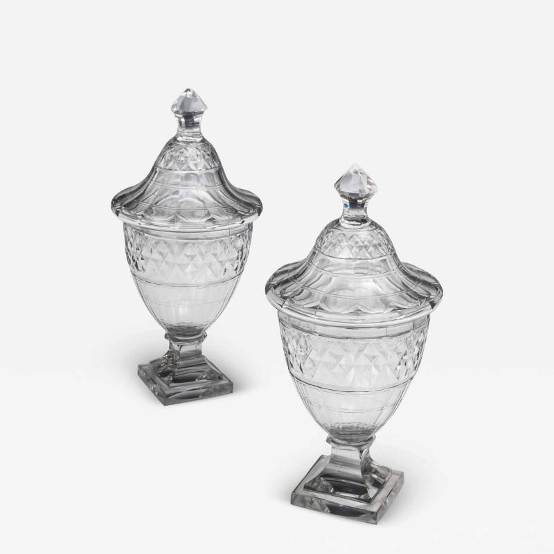 AN EXCEPTIONAL PAIR OF GEORGE III CUT GLASS URNS COVERS