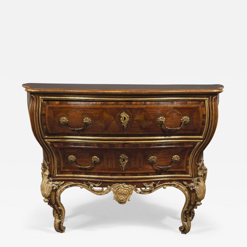 AN EXTRAORDINARY WALNUT AND EXOTIC WOODS INLAID PARCEL GILT COMMODE