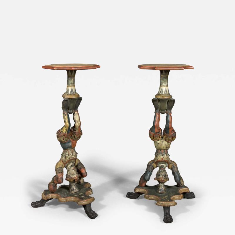 AN INTERESTING PAIR OF CARVED AND POLYCHROME PAINTED STANDS