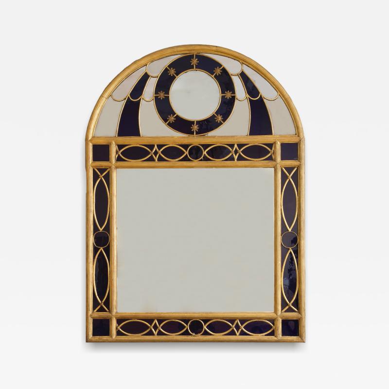 AN UNUSUAL GILTWOOD AND GILT PEWTER MIRROR SET WITH BLUE GLASS