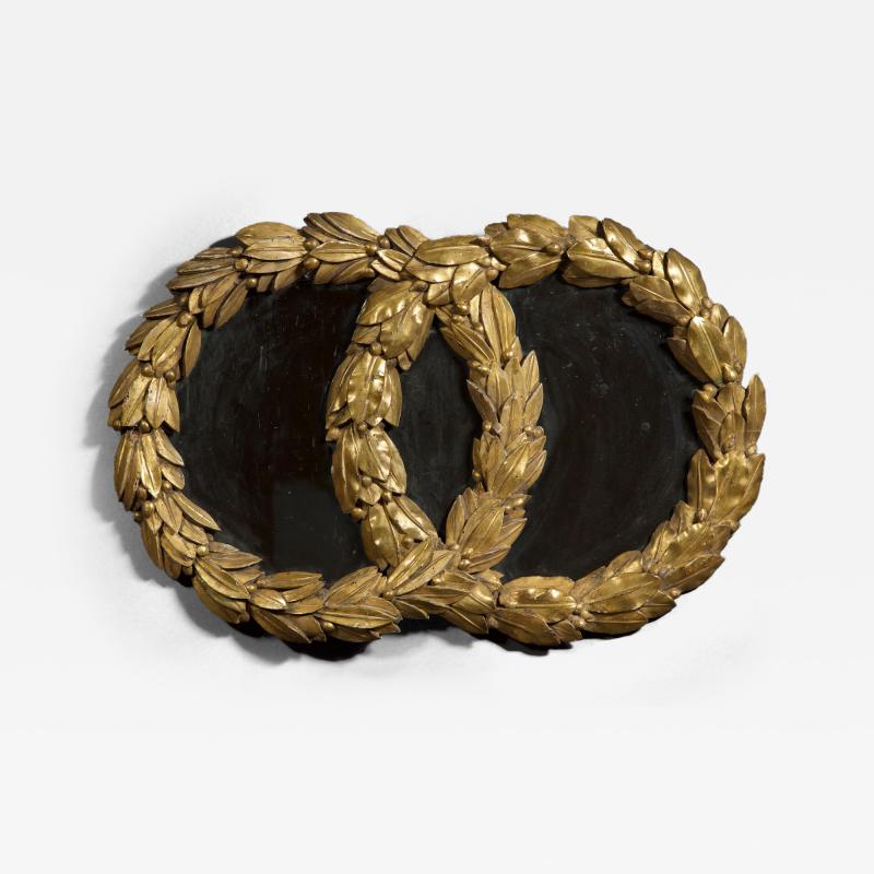 AN UNUSUAL NEOCLASSICAL MIRROR IN THE FORM OF INTERLOCKING LAUREL WREATHS